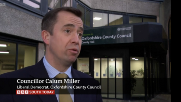 Councillor Calum Miller giving an interview to the BBC outside County Hall, Oxford