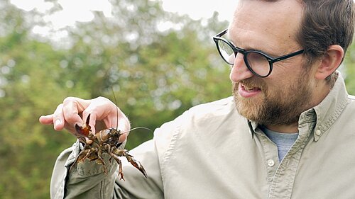 Freddie holding a crayfish