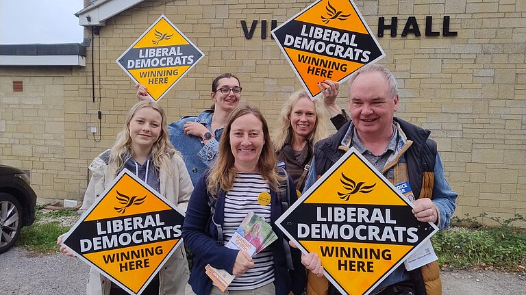A picture of a group of lib dems, with Hannah Griffin, the candidate for the Ridgeway Byelection, stood at the front