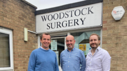Calum Miller in front of Woodstock Surgery