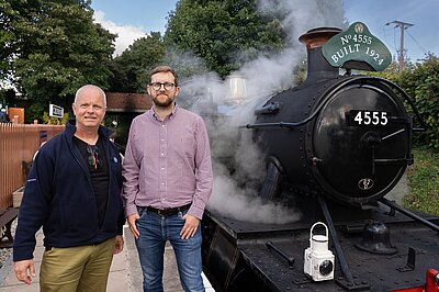Freddie with Councillor Ed Sadler in front of a train