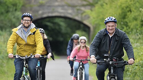 Ed Davey and Freddie van Mierlo cycling on the Pheonix Trail in Thame