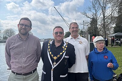 Freddie standing next to the river with with the team organising the Adaptive Time Trials