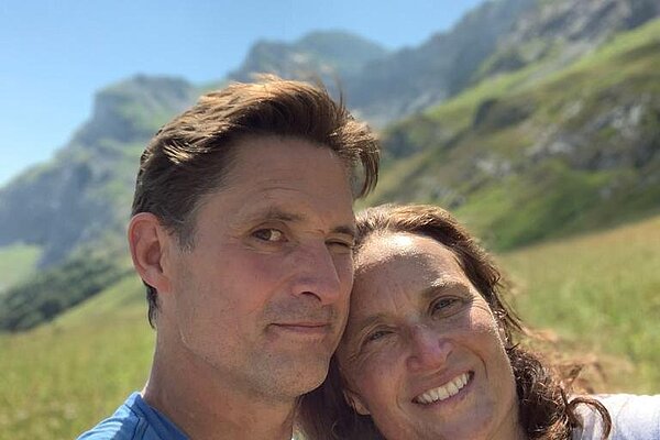 With his wife Sophie trekking in the Alps.