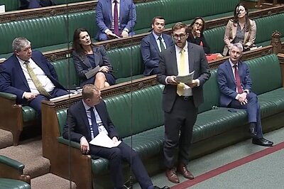 Freddie standing in Parliament