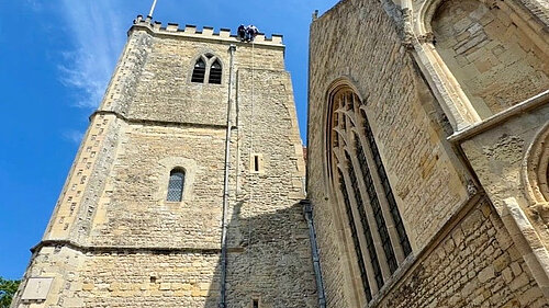 Freddie abseiling down Dorchester Abbey tower