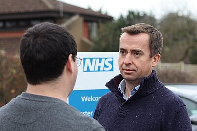 Calum Miller speaking with residents about NHS waiting lists