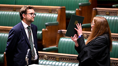 Freddie swearing in as an MP in 2024